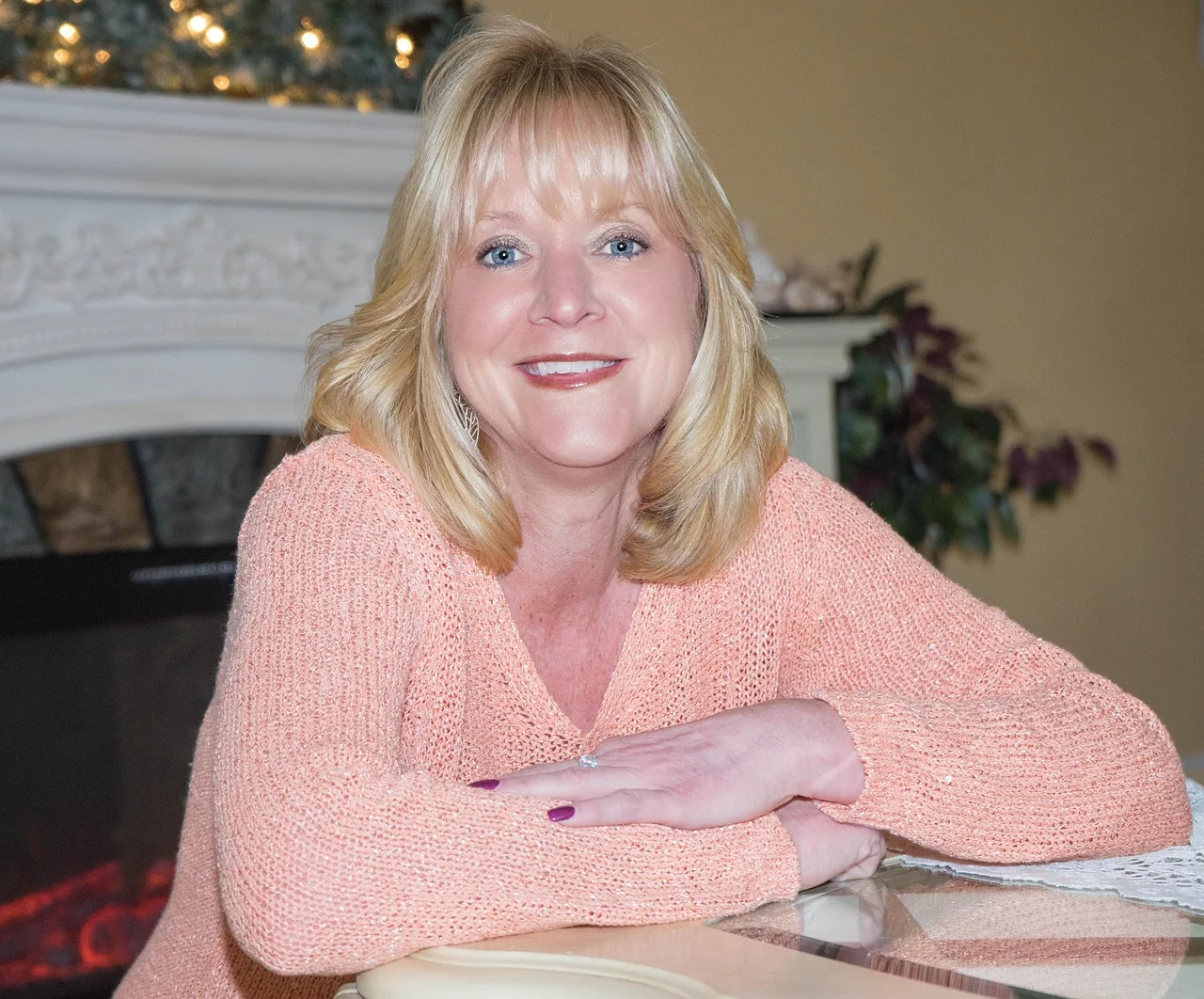 Older woman sitting at a table at home